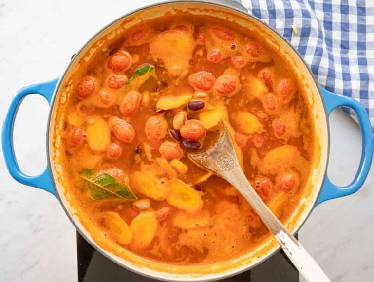 Step 3 simmering beans and broth together for rich comforting sauce.