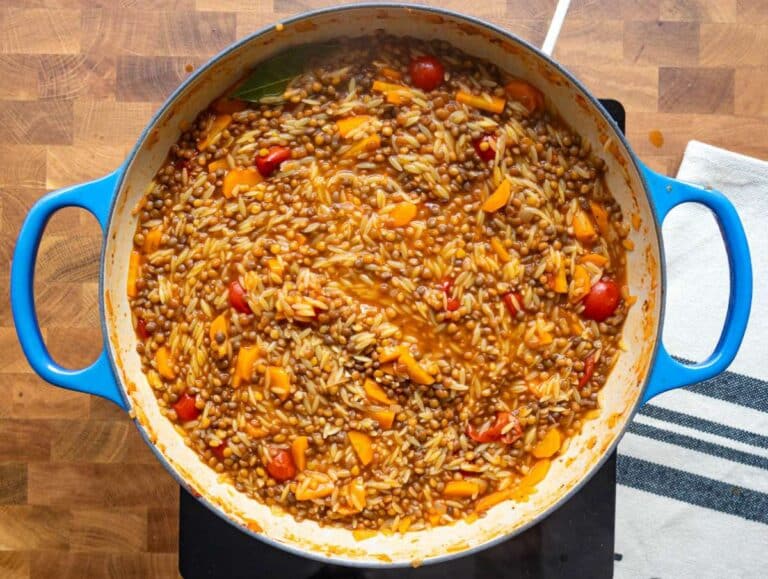 Step 4 Cooking orzo until creamy and al dente for a cozy one pot vegetarian meal.