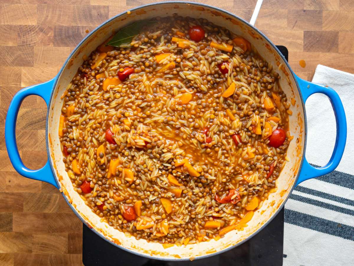 Step 4 Cooking orzo until creamy and al dente for a cozy one pot vegetarian meal.
