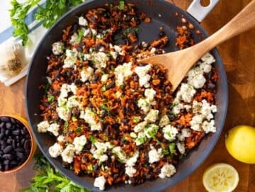 Step 4 Finished skillet topped with marinated feta and parsley ready to serve.