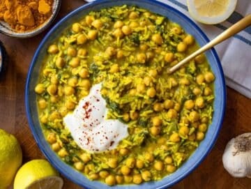 Step 4 Finished turmeric rice with chickpeas and spinach topped with Greek yogurt and lemon ready to serve.