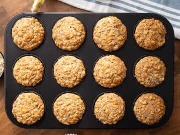 Step 4 Golden banana oatmeal muffins just baked still in the muffin pan.