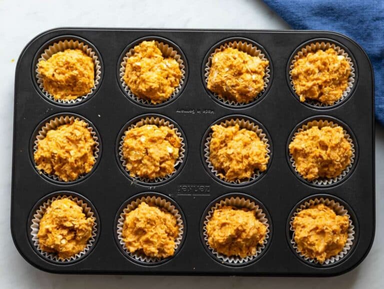 Step 4 Muffin batter spooned into lined tray ready for baking.
