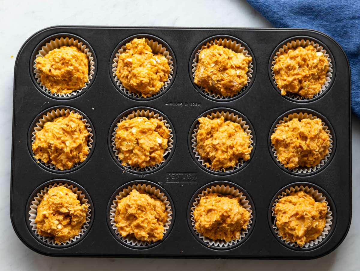 Step 4 Muffin batter spooned into lined tray ready for baking.