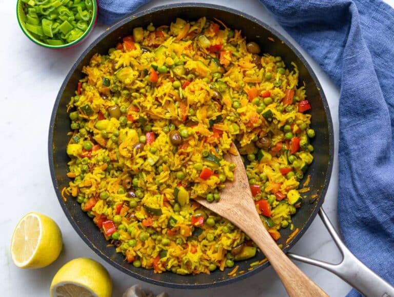 Step 4 Rice and olives mixed into golden skillet with turmeric sauce.