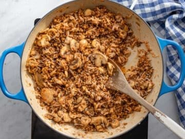 Step 4 Sauce simmering in skillet coating rice lentils and mushrooms.