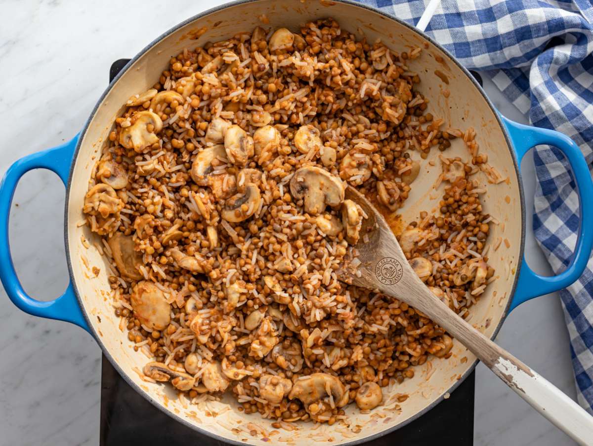 Step 4 Sauce simmering in skillet coating rice lentils and mushrooms.
