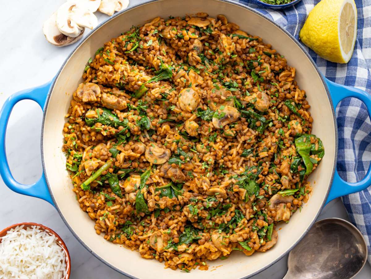 Step 5 Spinach wilting into Mediterranean mushroom rice stir fry.