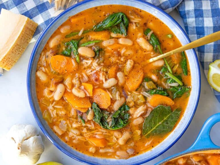 Step five Greek bean stew with rice inspired by fasolada served in a bowl.