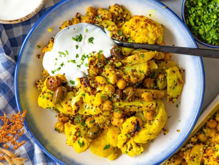 Step four adding parsley lemon and quinoa to roasted vegetables on baking sheet and serving in a bowl.