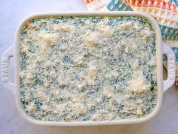 Step three creamy spinach artichoke mixture spread evenly in baking dish.