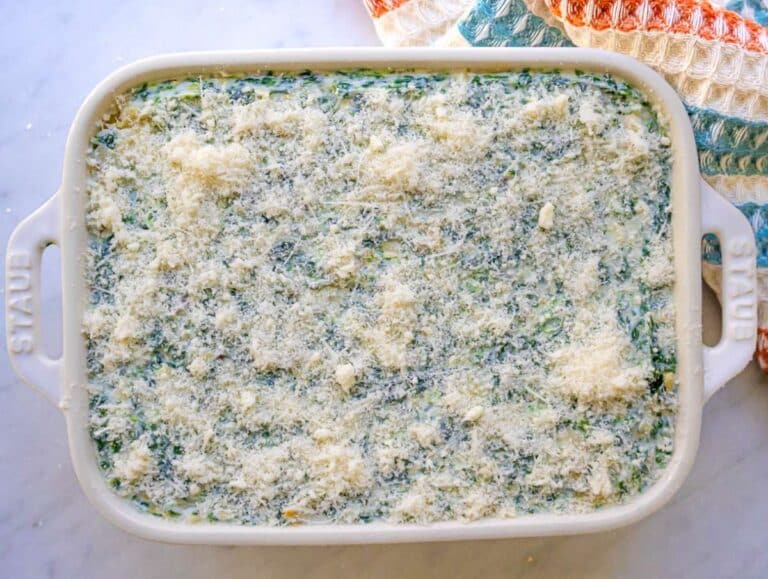 Step three creamy spinach artichoke mixture spread evenly in baking dish.