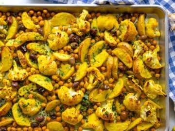 Step three roasted turmeric vegetables coming out of oven golden and tender.