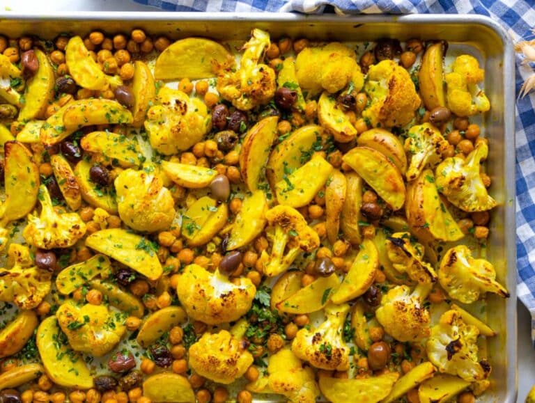 Step three roasted turmeric vegetables coming out of oven golden and tender.