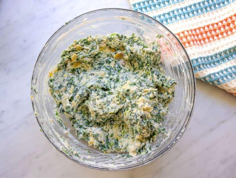 Step two chopped artichokes yogurt ricotta and parmesan stirred into creamy mixture.