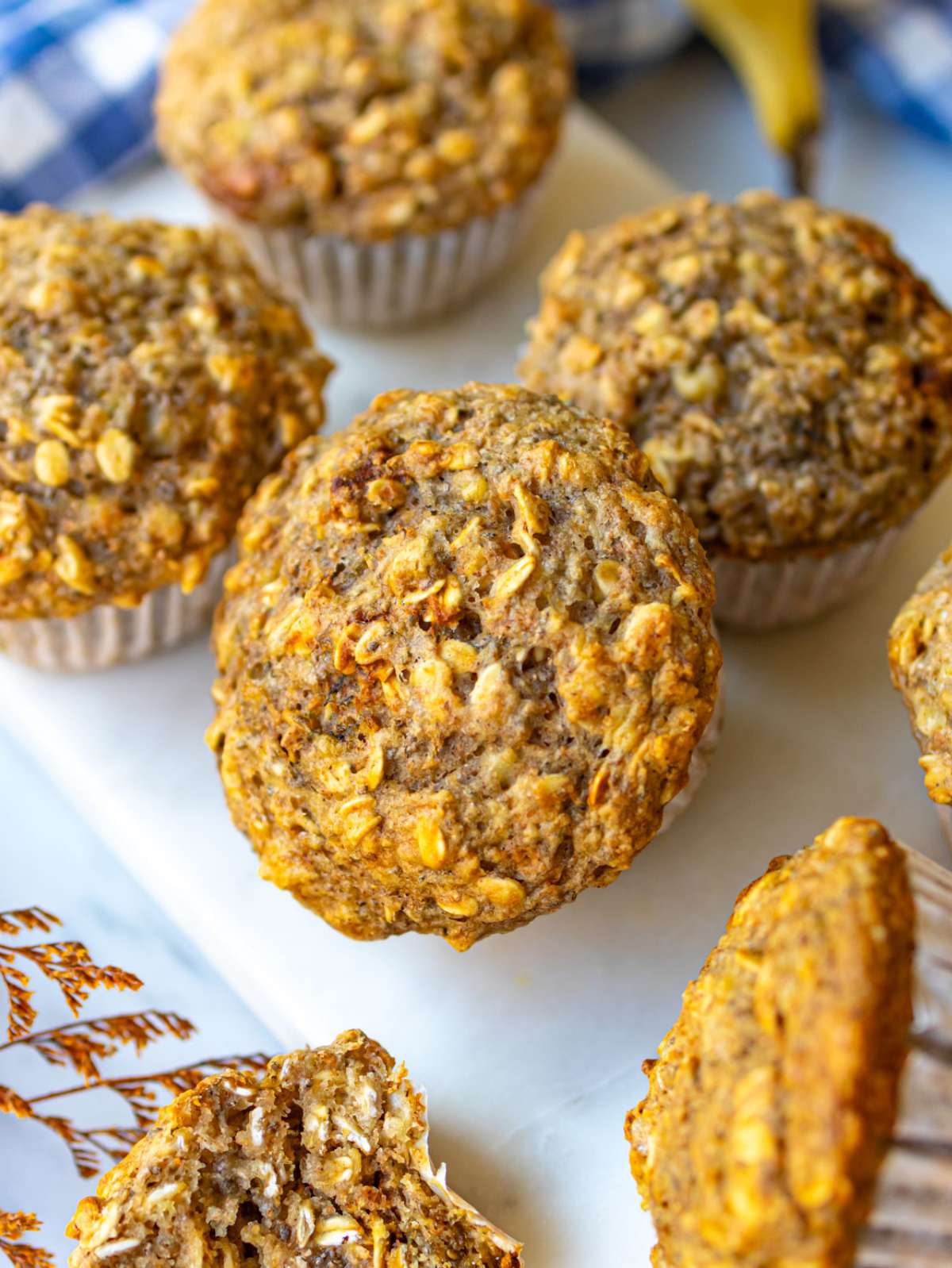 Close up soft high fiber muffins showing wholesome texture with oatmeal and chia seeds.