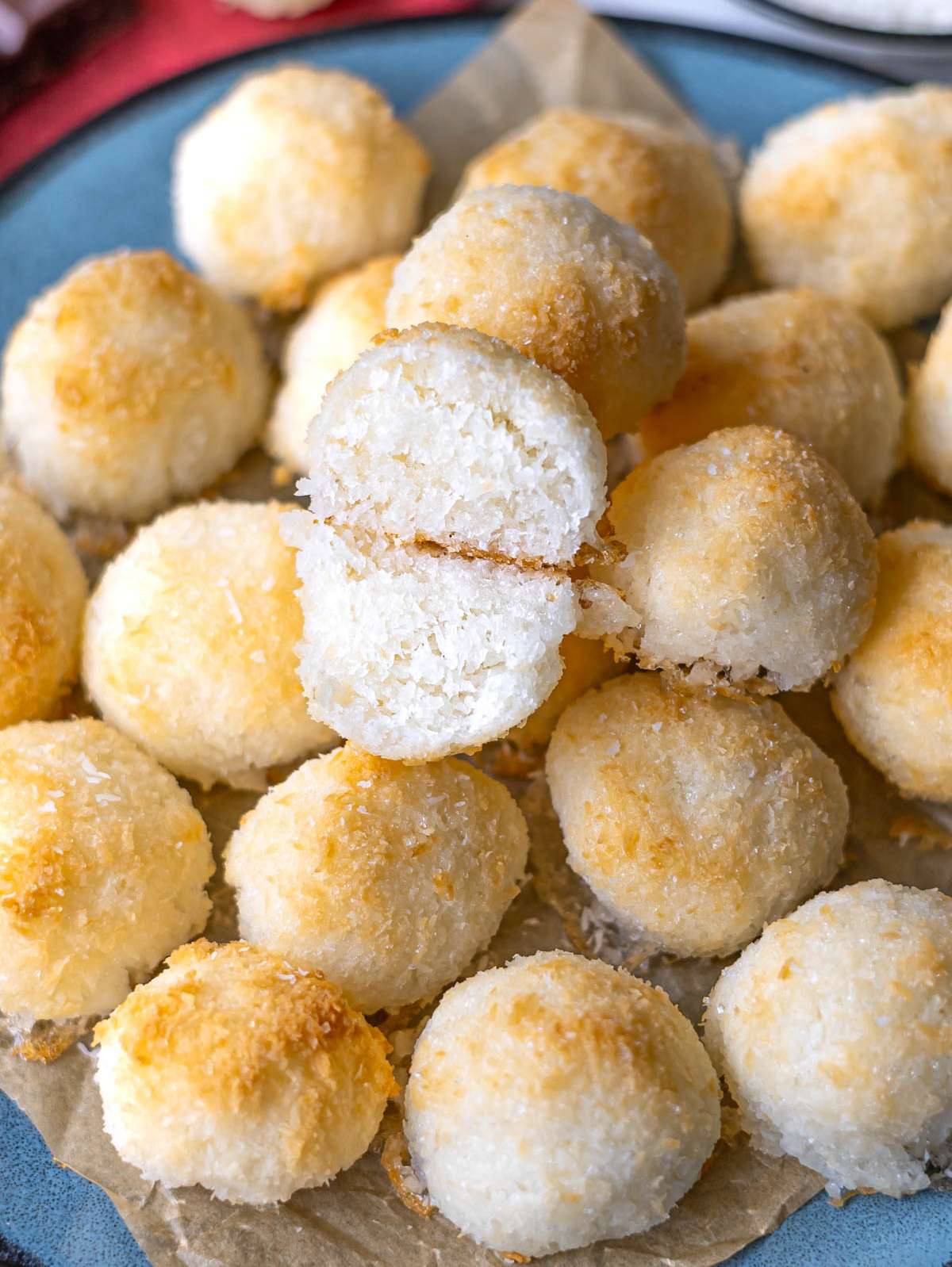 Finished coconut macaroons close up showing crisp golden tops and tender inside texture.