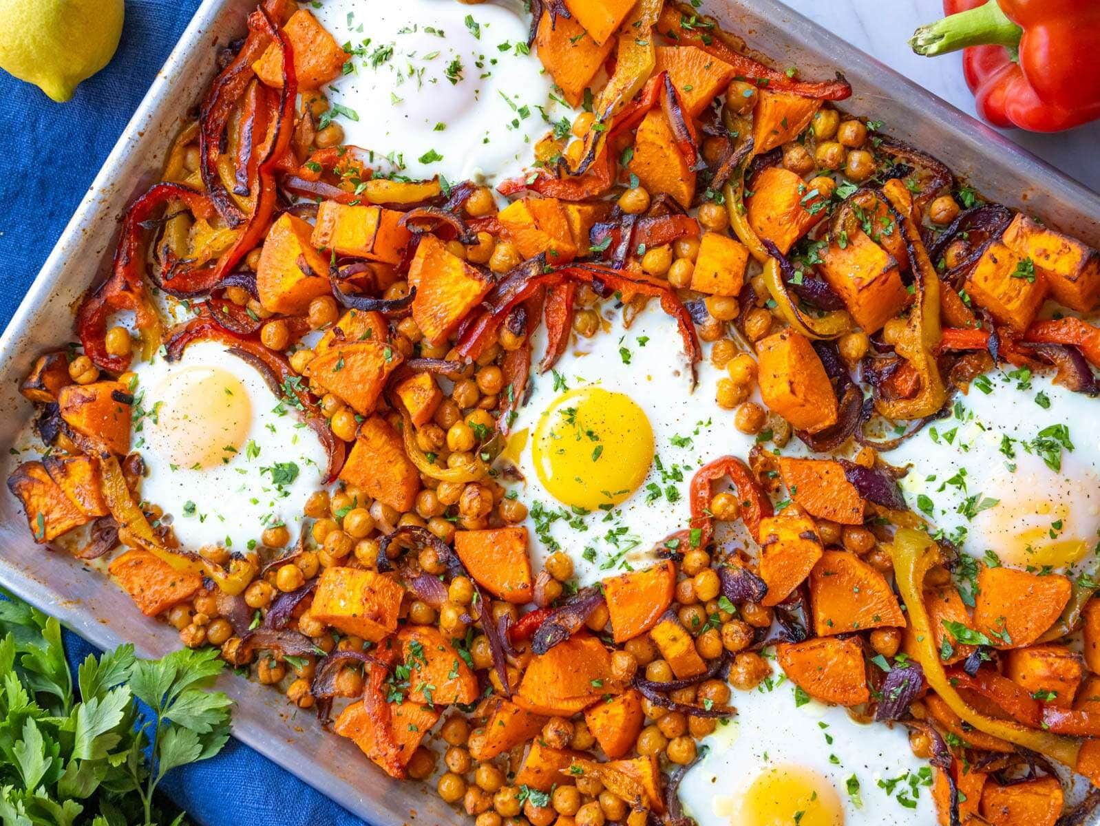 Finished dish top down healthy sheet pan eggs and veggies with sweet potatoes and chickpeas.