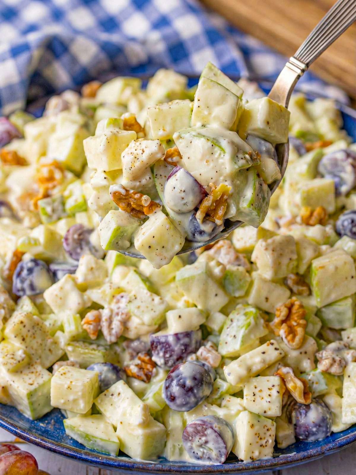 Finished salad close up with creamy yogurt dressing and crisp apples.