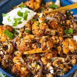 Greek cauliflower bowl with yogurt sauce parsley and fresh lemon juice served warm.