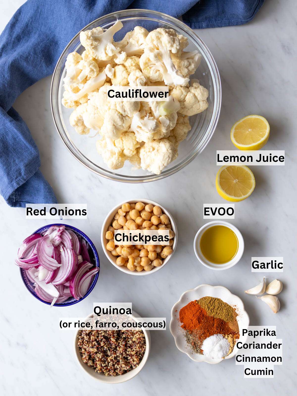 Ingredients for cauliflower shawarma bowl with spices veggies chickpeas and quinoa.