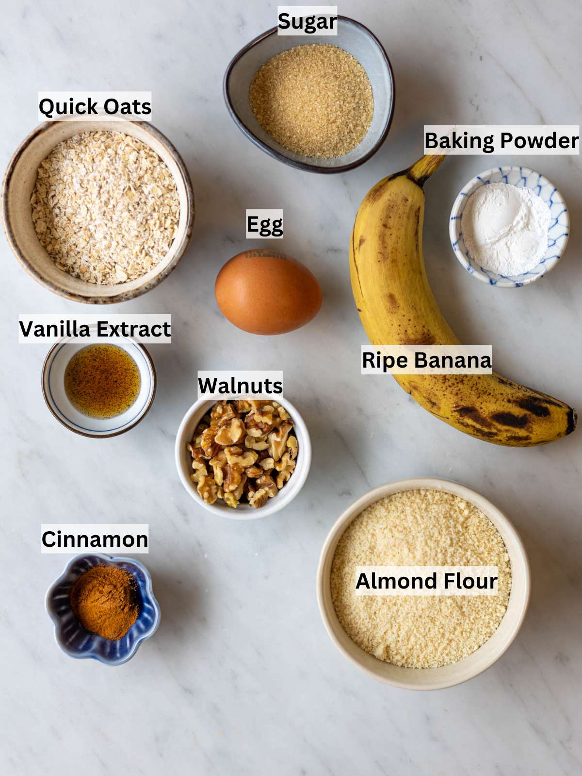Ingredients for healthy banana cookies including banana almond flour oats and walnuts.