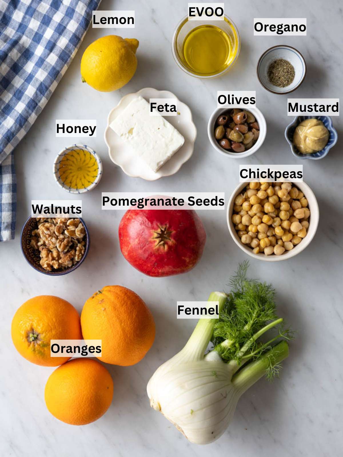 Ingredients for orange fennel salad with fennel oranges chickpeas feta olives nuts.