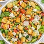 Mediterranean chopped pita salad with feta fresh vegetables and chickpeas ready to serve.