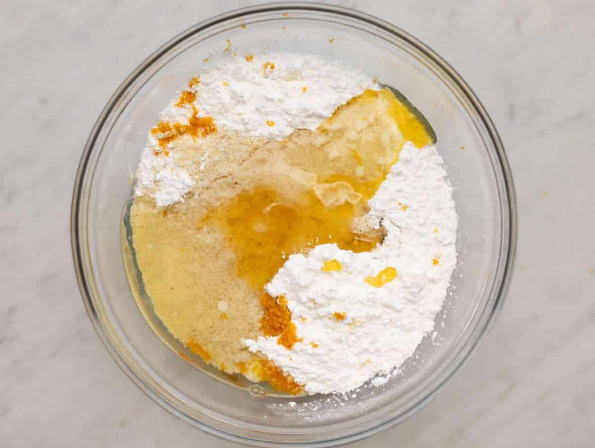 Step 1 Combining almond flour powdered sugar egg white honey and orange zest in one bowl.
