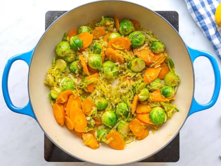 Step 1 Cooking leeks carrots and brussels sprouts in olive oil for vegetable orzo.