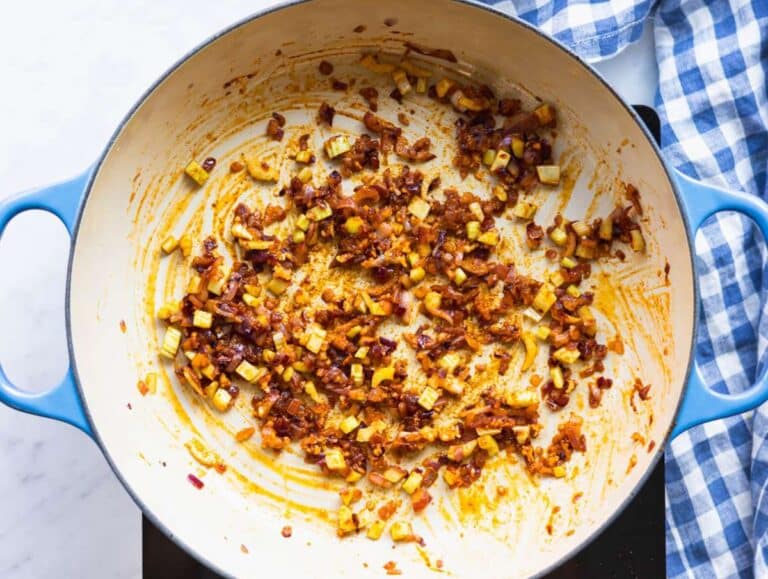 Step 1 Cooking onion celery and garlic in olive oil to build flavor for sweet potato chickpea soup.