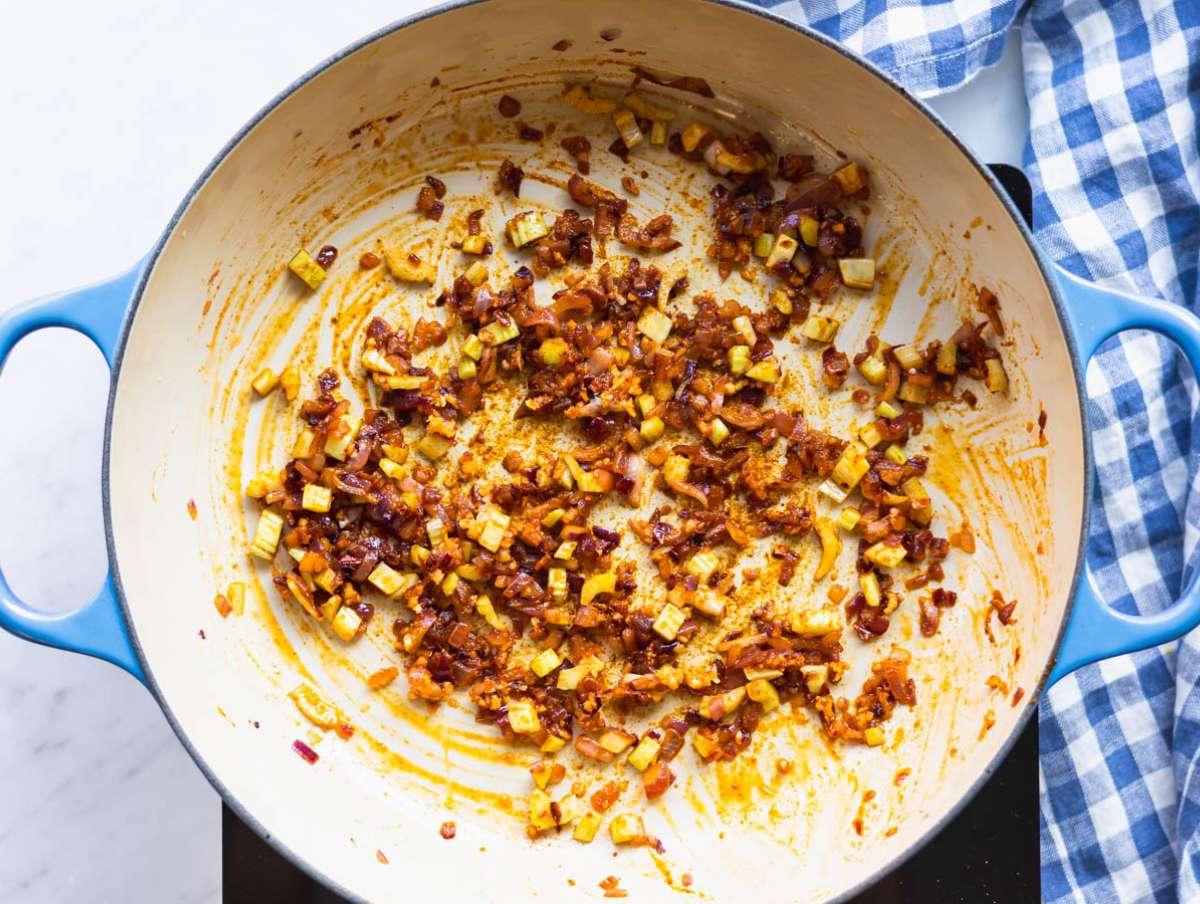 Step 1 Cooking onion celery and garlic in olive oil to build flavor for sweet potato chickpea soup.
