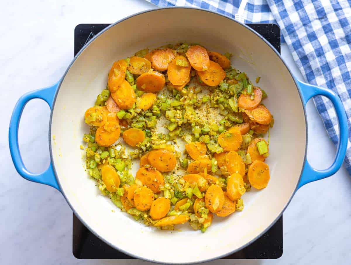 Step 1 Cooking onions carrots and celery in pot for one pot lentil soup.