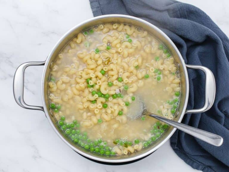 Step 1 Cooking pasta and peas together in one pot for easy macaroni salad recipe.