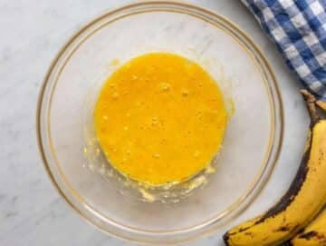 Step 1 Mashing ripe banana and egg together in bowl for cookie dough.
