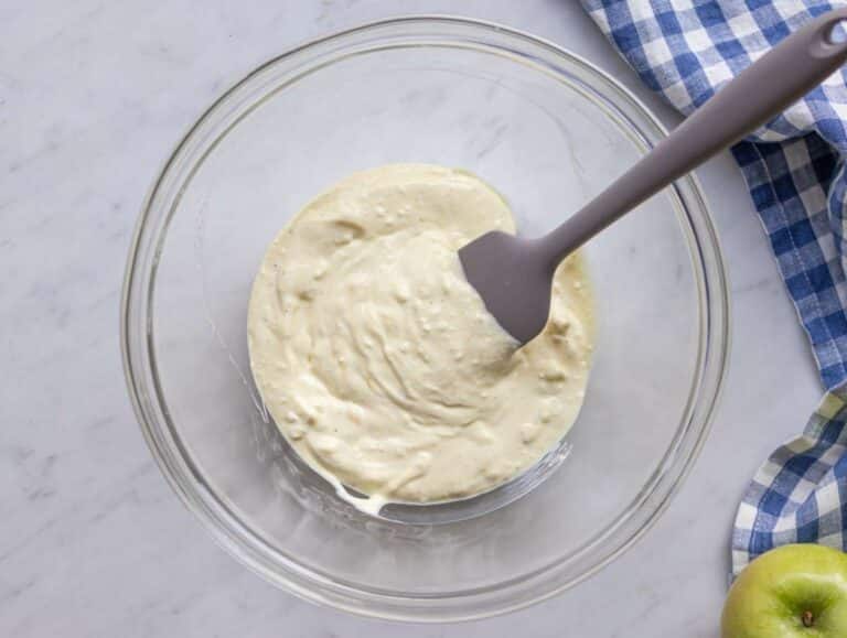 Step 1 Mixing creamy yogurt dressing for healthy Waldorf salad in a large bowl.