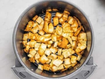 Step 1 Toasting pita pieces in oven until golden and crunchy for salad topping.