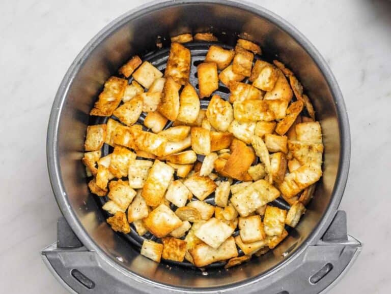 Step 1 Toasting pita pieces in oven until golden and crunchy for salad topping.