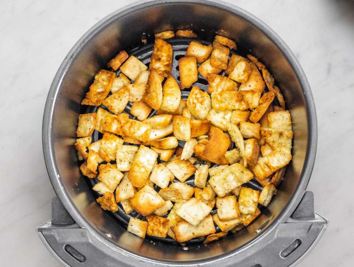 Step 1 Toasting pita pieces in oven until golden and crunchy for salad topping.