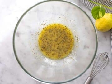 Step 1 Whisking lemon dressing in a large bowl for black eyed pea salad.