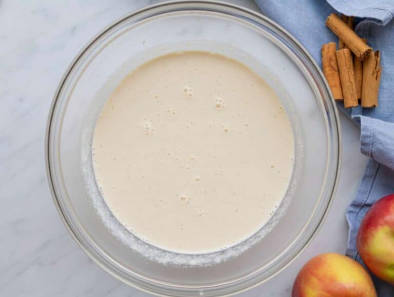 Step 1 Whisking the liquid base milk yogurt honey applesauce for this easy make ahead breakfast.