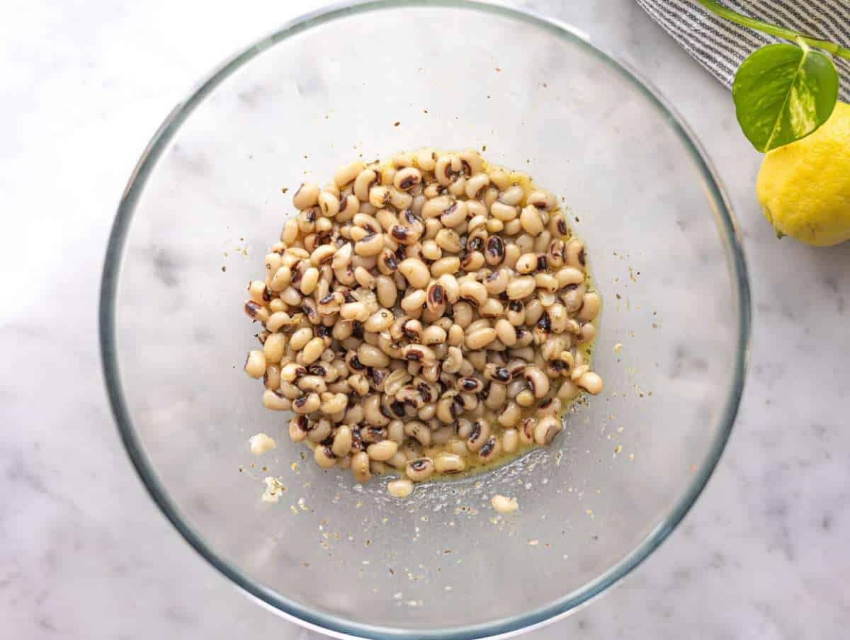 Step 2 Black eyed peas marinating in lemon dressing for easy healthy bean salad.