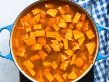 Step 2 Simmering sweet potatoes and chickpeas in broth until tender for smooth blended soup.