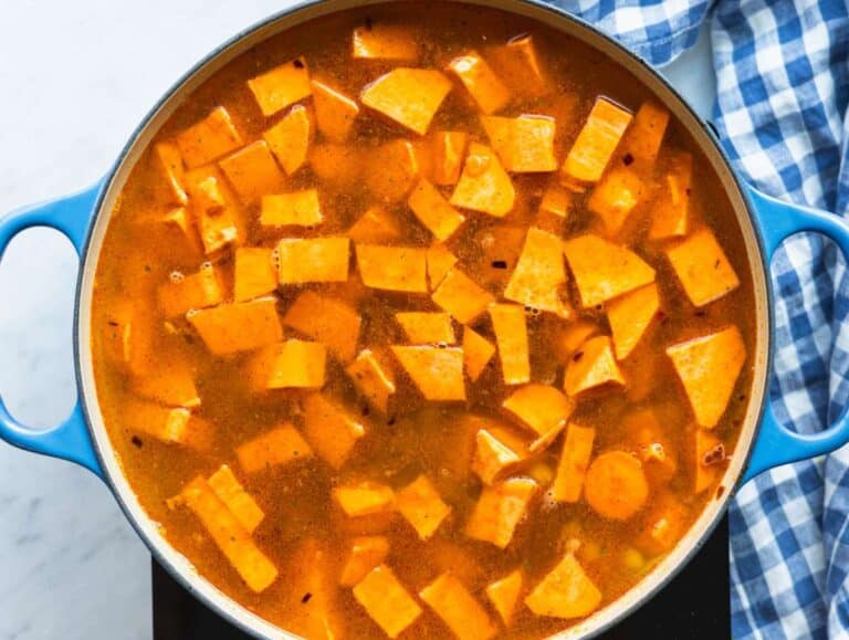 Step 2 Simmering sweet potatoes and chickpeas in broth until tender for smooth blended soup.