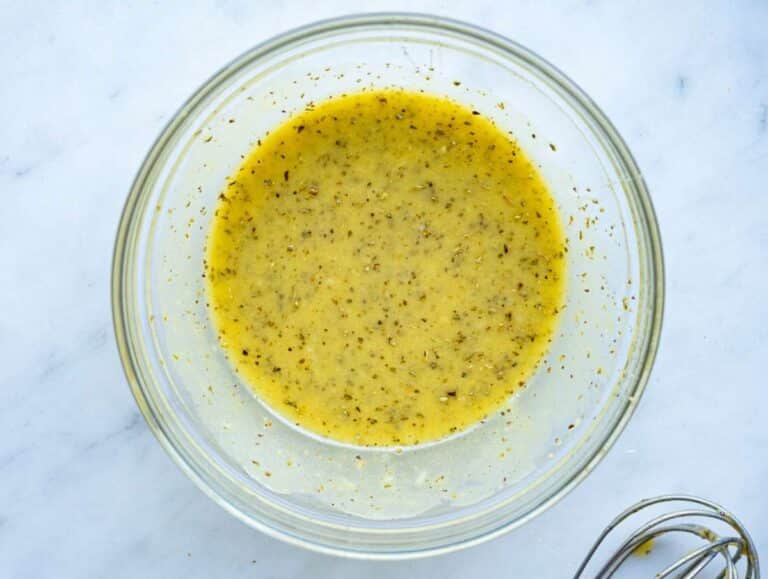 Step 2 Whisking lemon dressing for easy roasted cauliflower orzo meal.