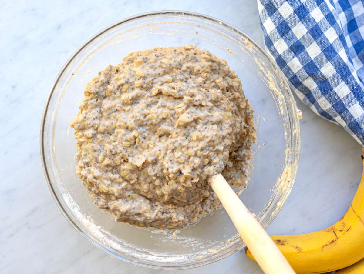 Step 3 Adding dry ingredients to create a tender whole wheat muffin batter.