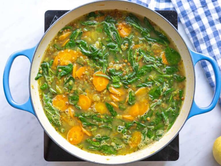 Step 3 Lemon lentil soup simmering gently on stove in large pot.