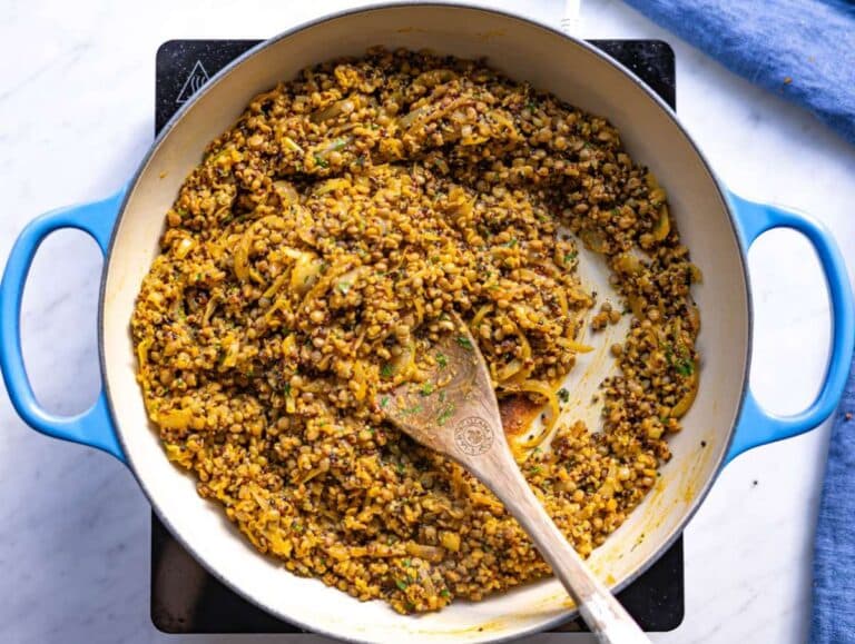 Step 3 Lentils and quinoa added to skillet with onions and golden sauce.