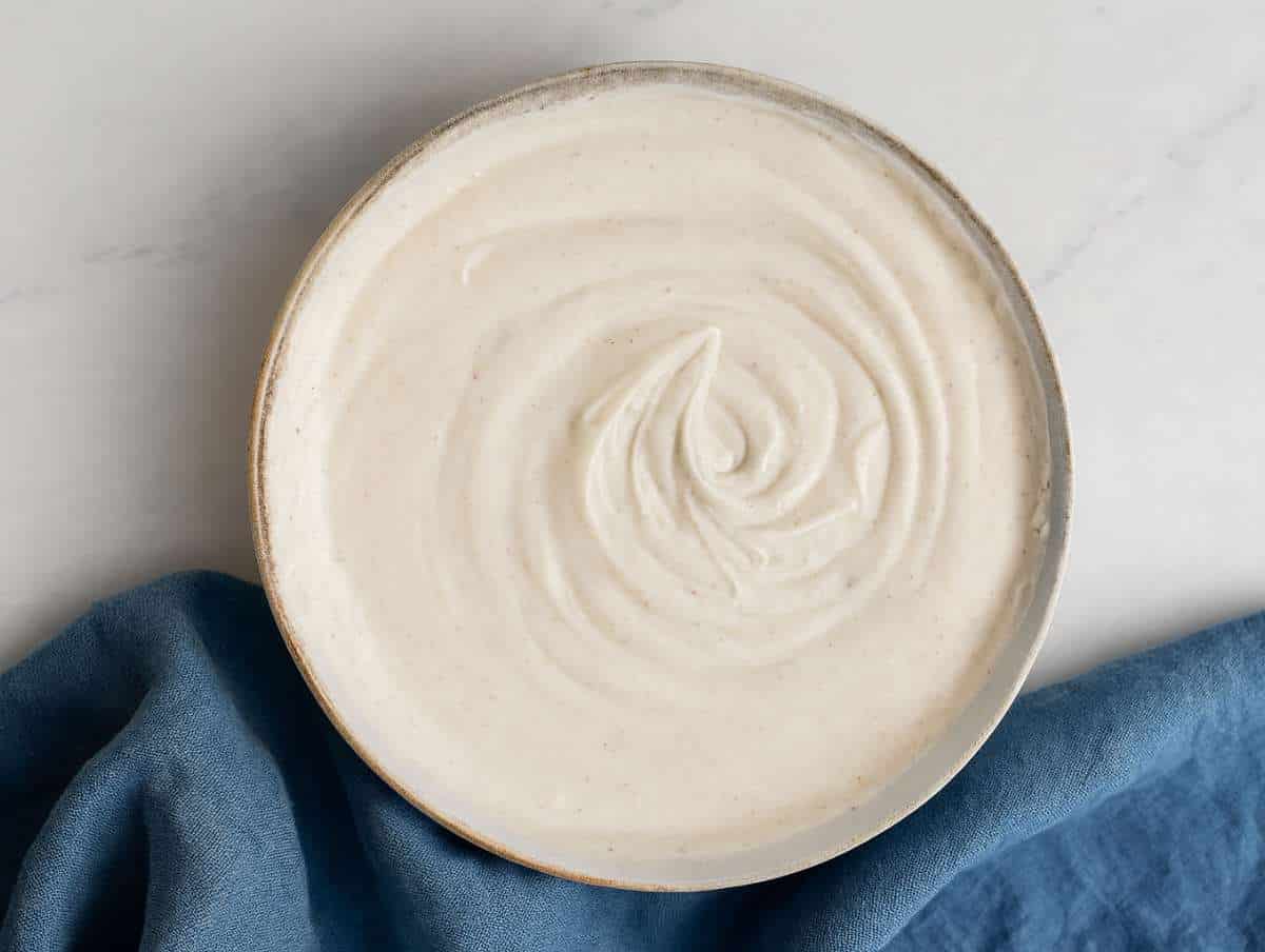 Step 3 Mixing Greek yogurt and lemon juice in a bowl to make a tasty and lemony sauce.