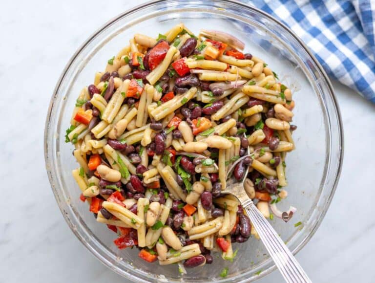 Step 3 Mixing pasta beans vegetables and herbs together in bowl.